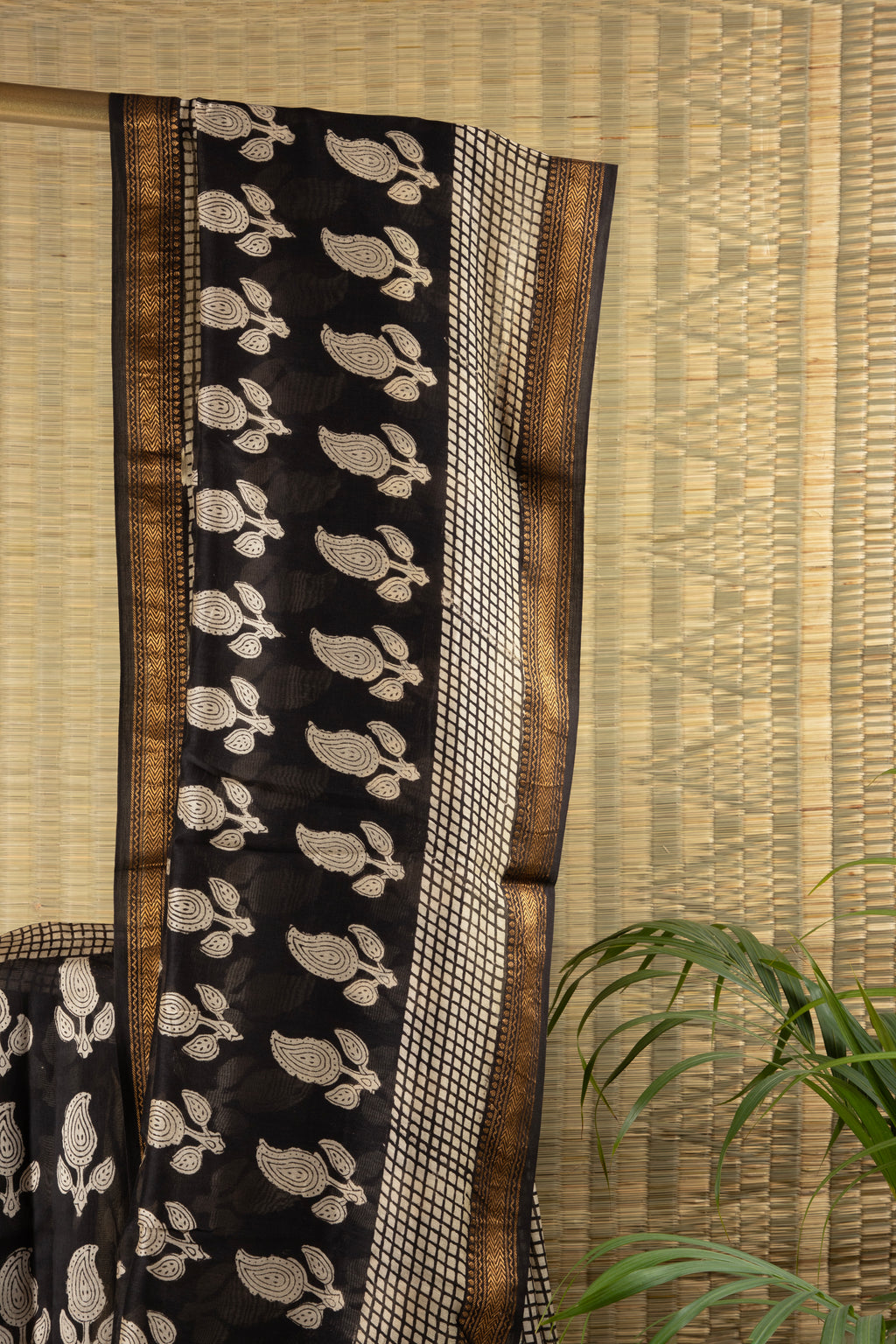 Black silk cotton block print saree with paisley motif