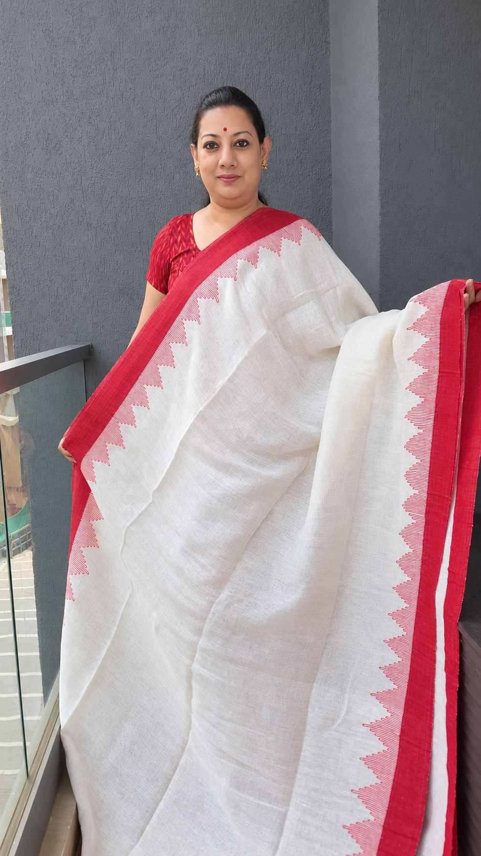 Red and white linen saree with temple design