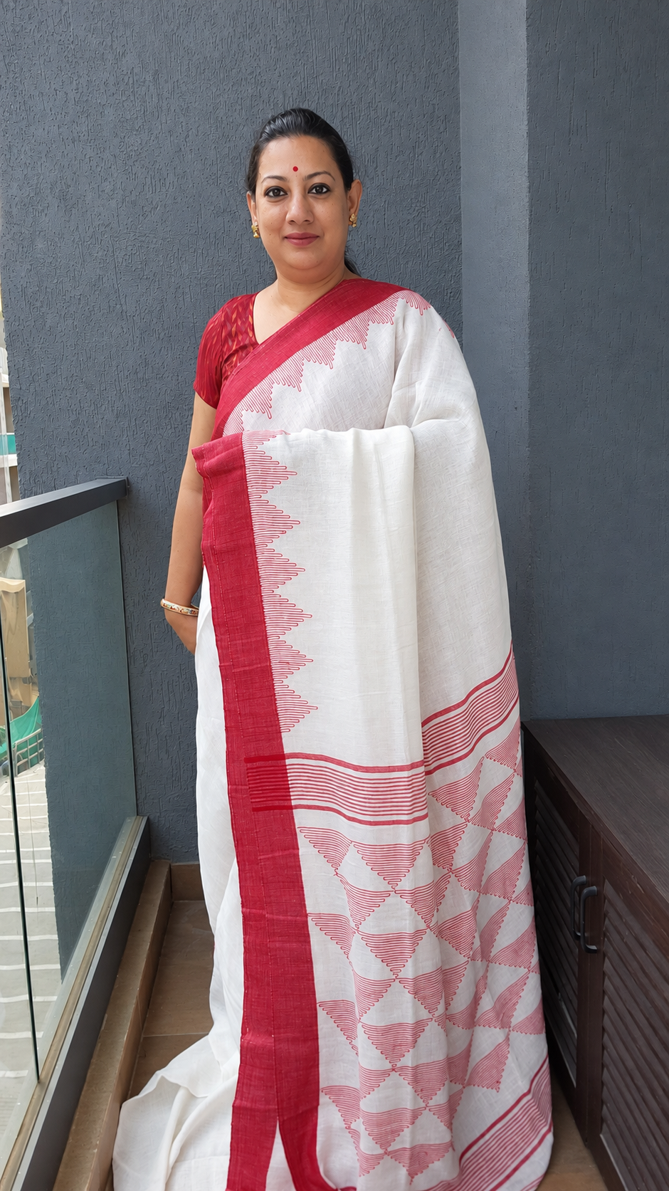 Red and white linen saree with temple design