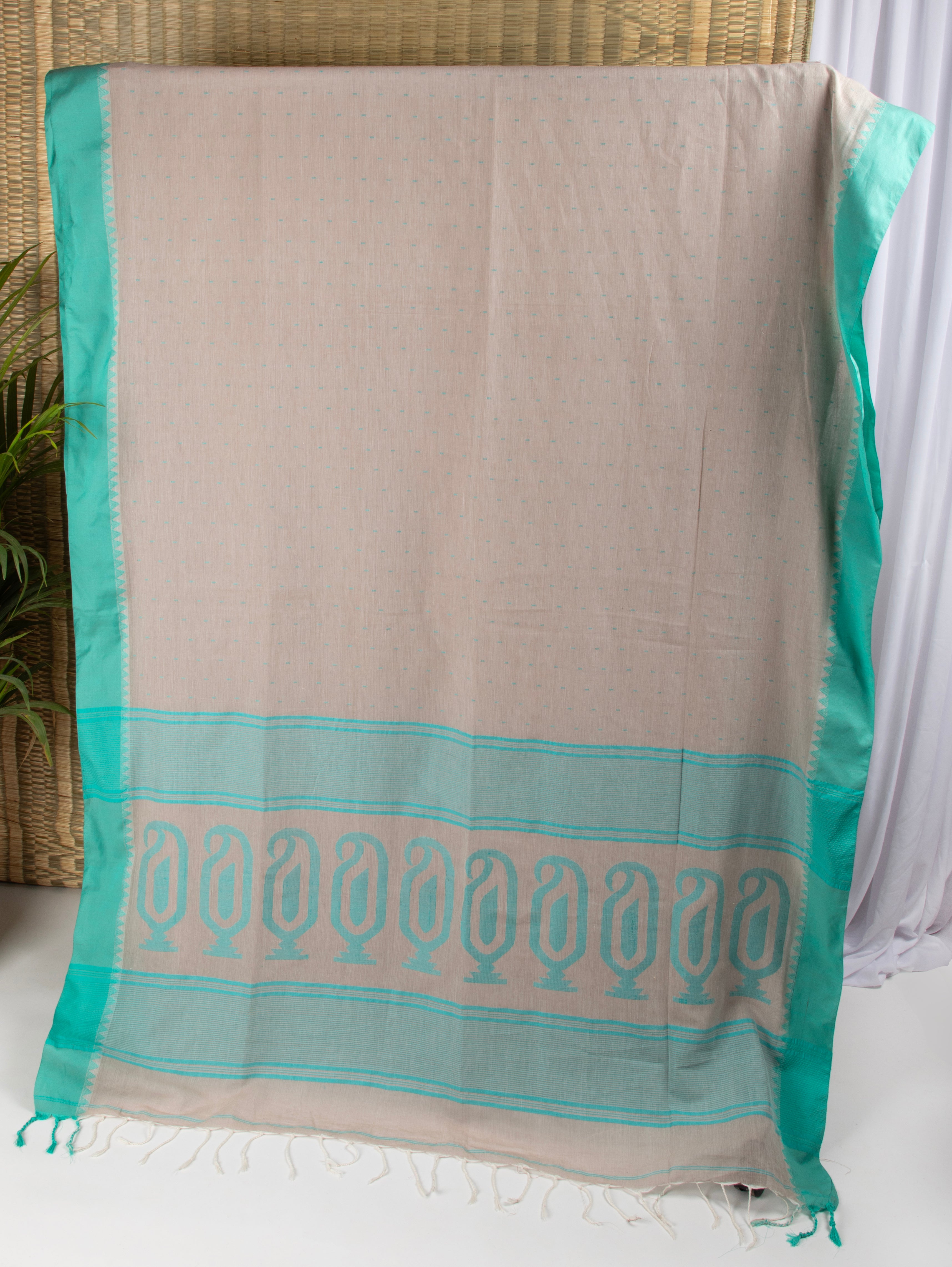 Stone beige cotton saree with turquoise blue details and multiple butas