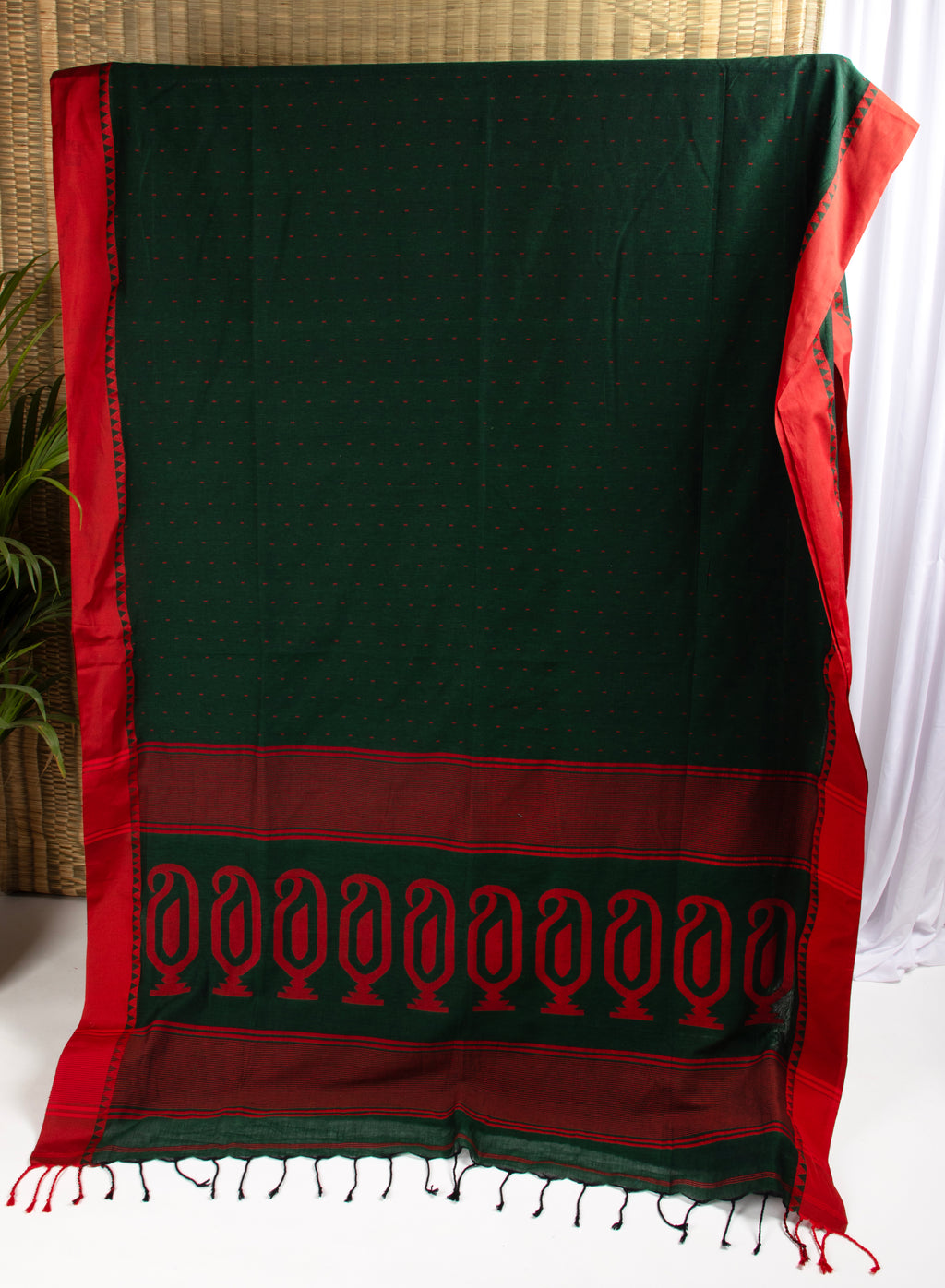 Bottle green saree with multiple butis