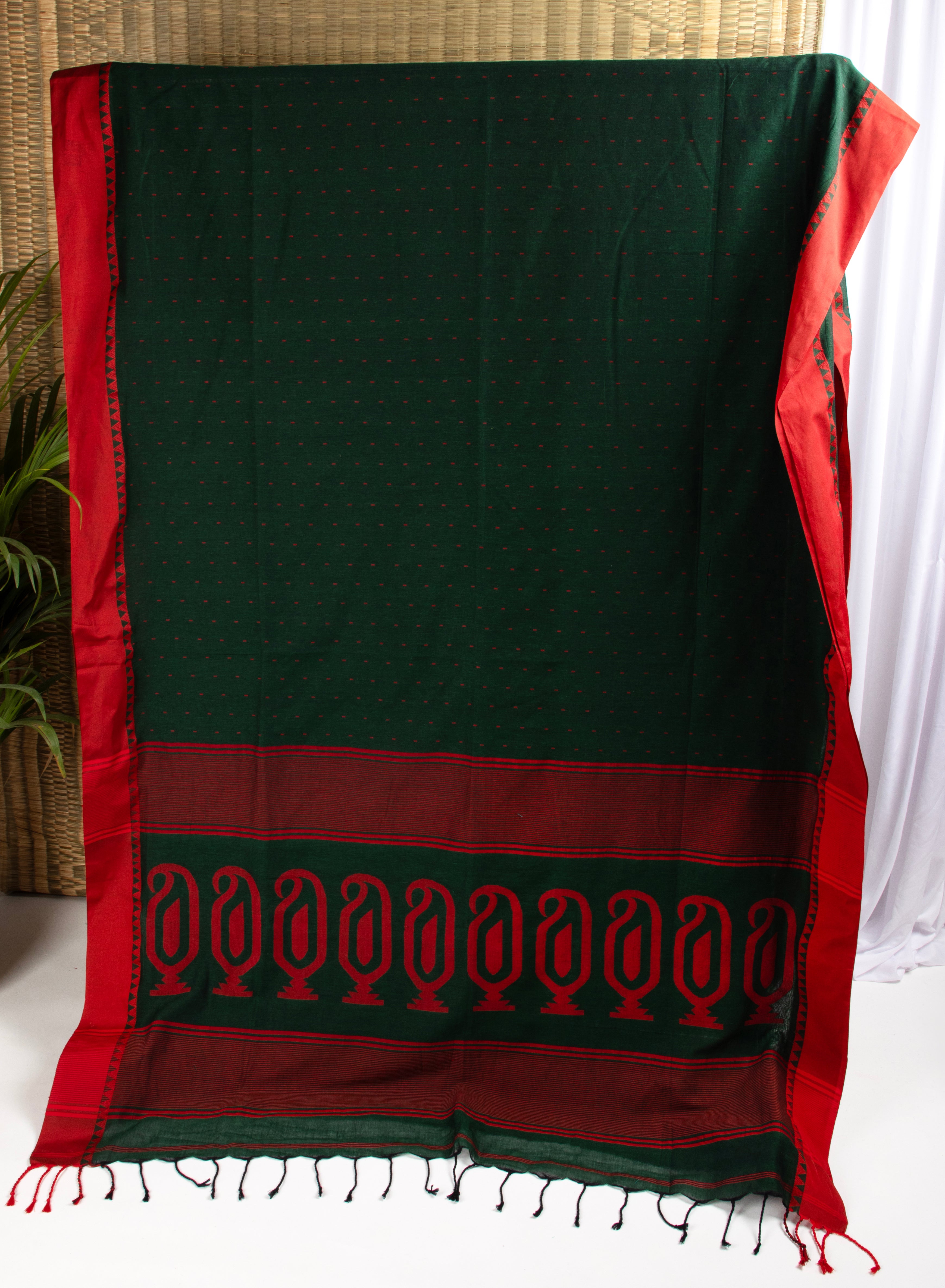 Bottle green saree with multiple butis