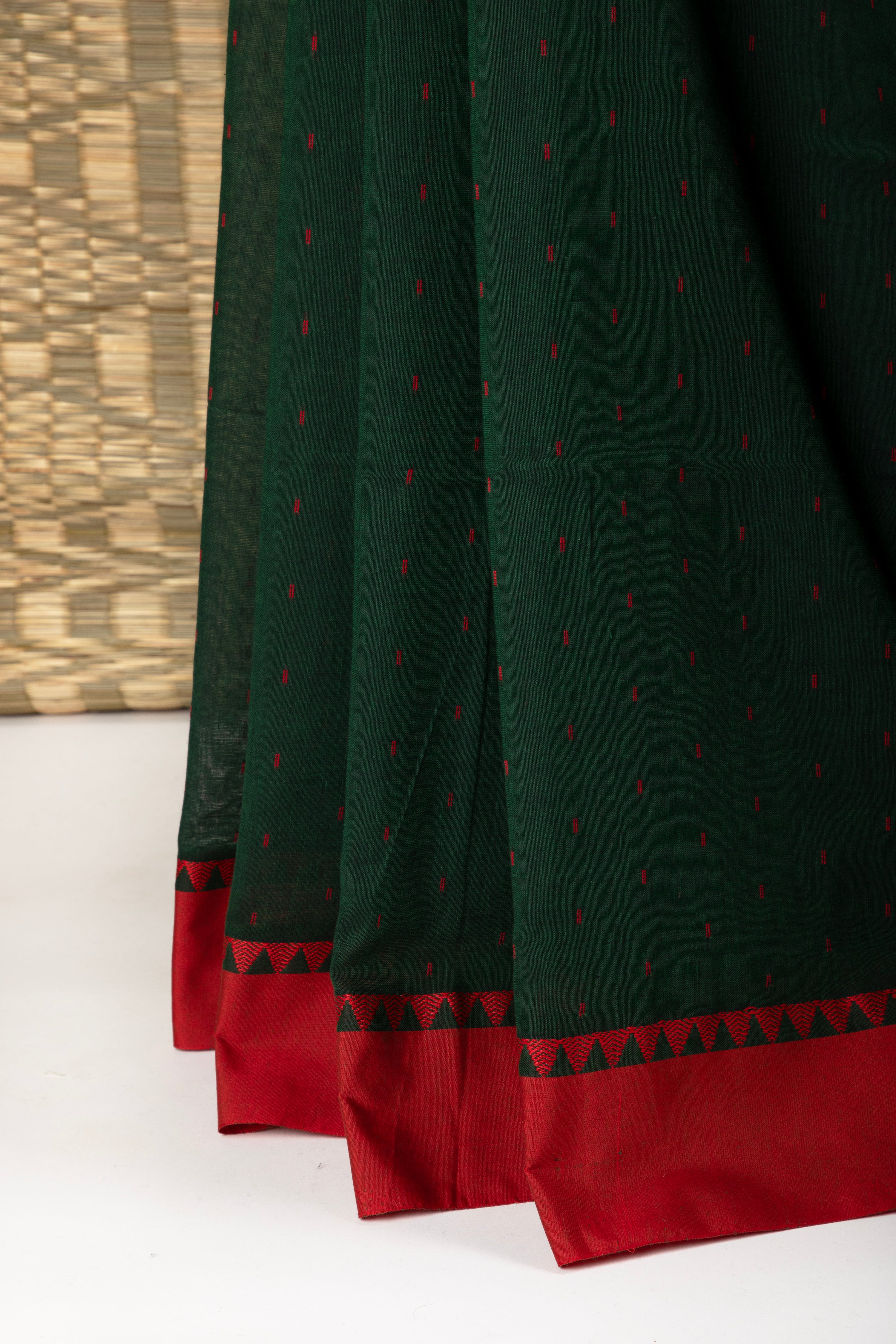 Bottle green saree with multiple butis