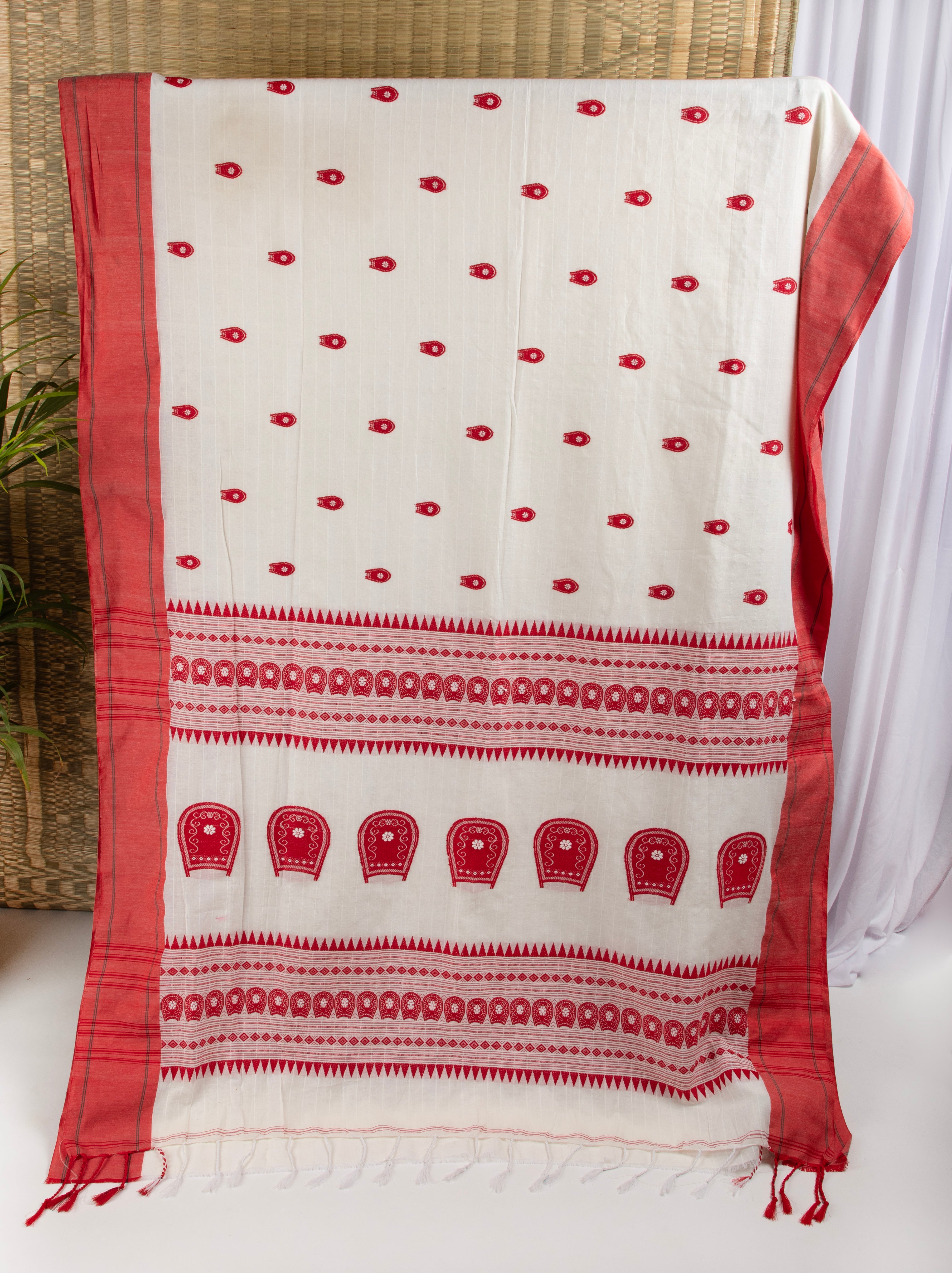 Off white and red saree with traditional motifs