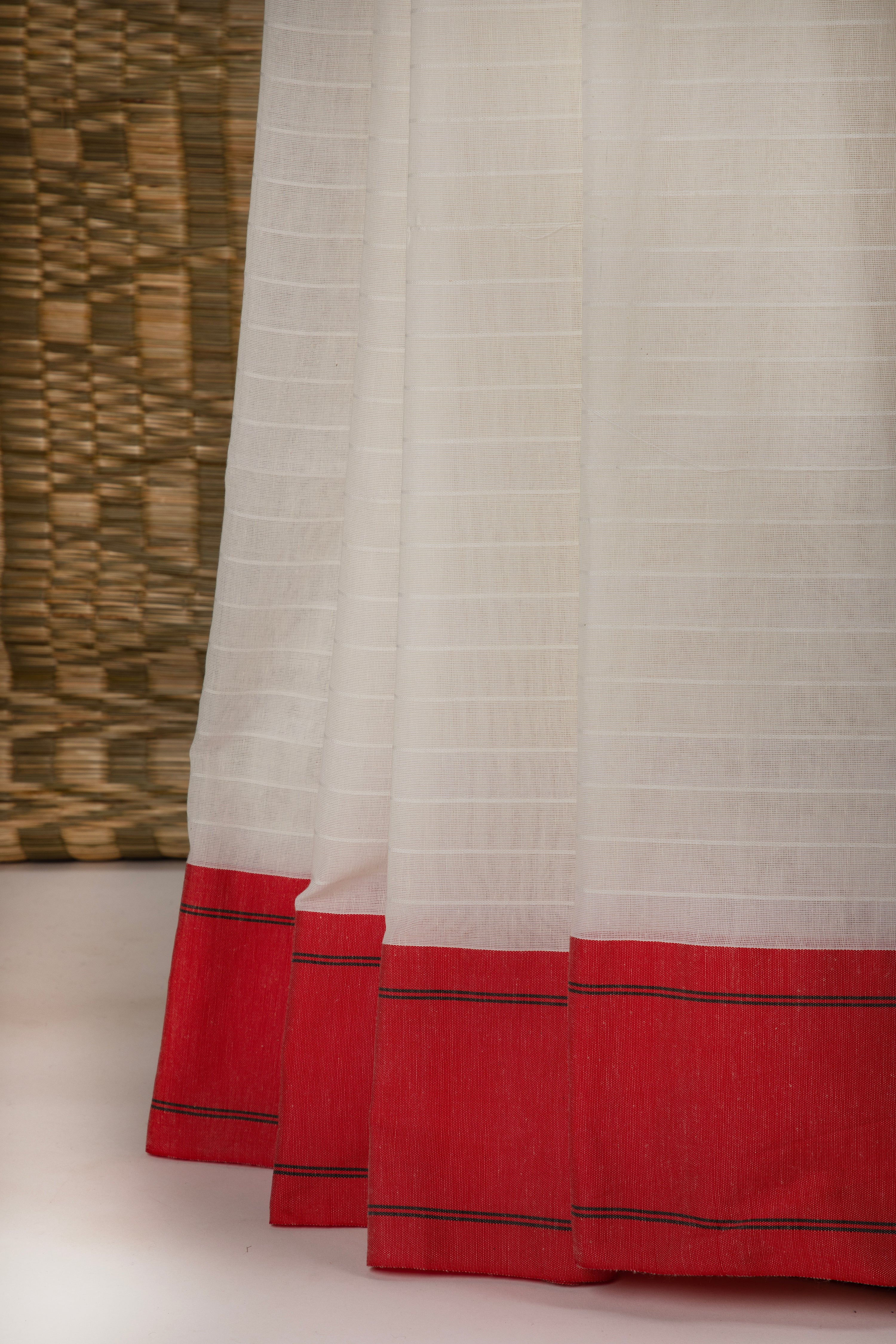 Off white and red saree with traditional motifs
