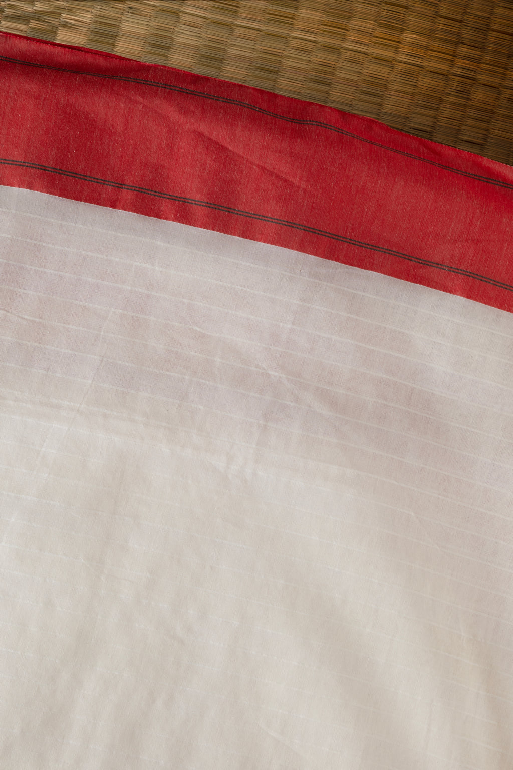 Off white and red saree with traditional motifs